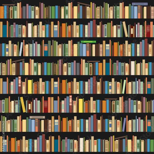 Books standing in a row on a dark background