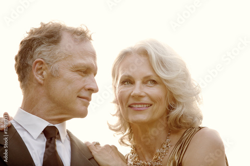 Portrait of mature couple in formal clothing photo