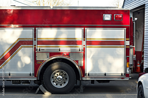 Cropped image of fire engine outside fire station