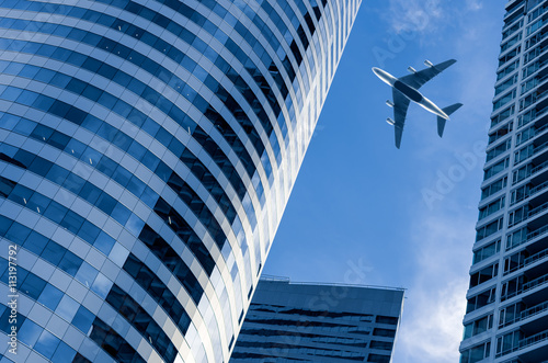 Airplane with building.
