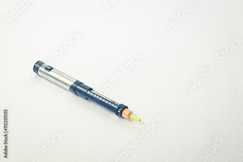 Insulin pen for diabetics on a clean white background