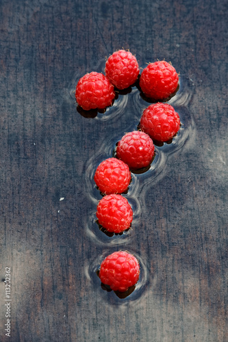 question mark of red raspberries