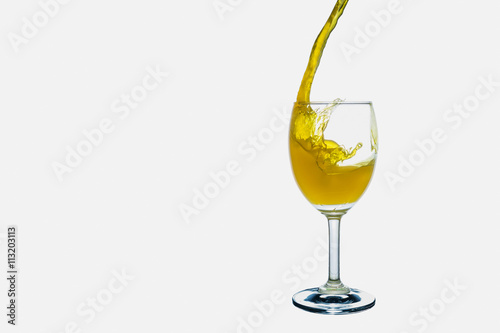 White wine splash into glass