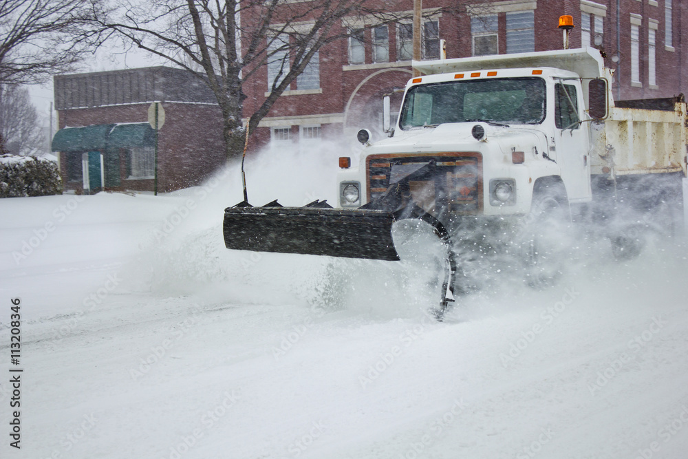 Snowplow truck on snow covered field Snowplow truck on snow covered field