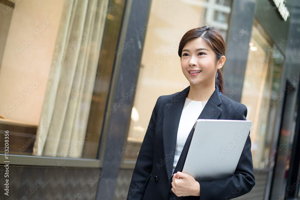 Asian business woman hold with laptop computer Asian business woman hold with laptop computer