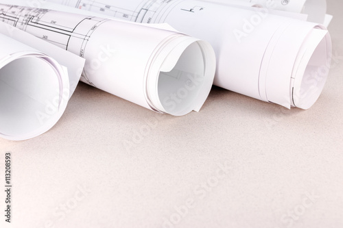 rolls of blueprints and architectural drawings