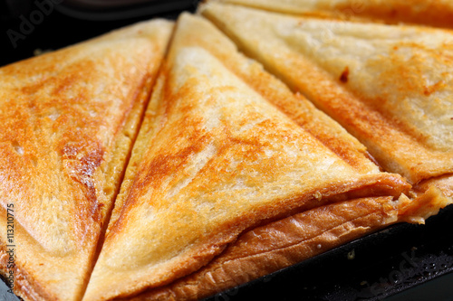 Tableau sur toile Toasted cheese sandwich grill / Toasted cheese sandwich on an electric sandwich