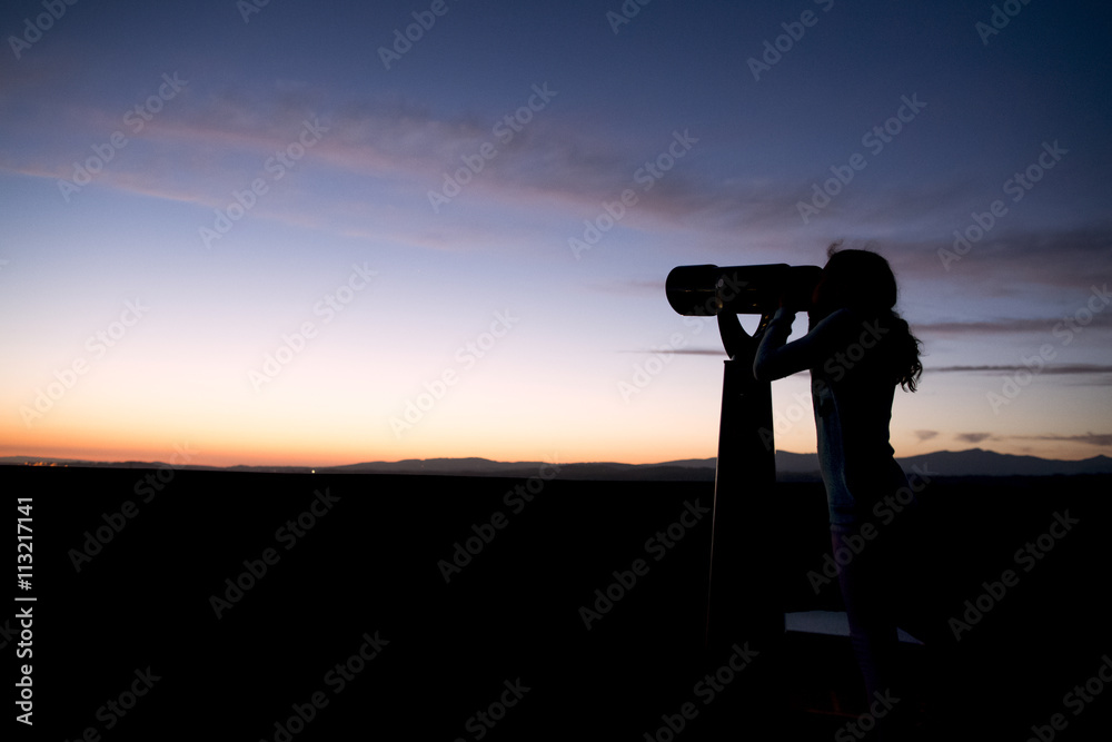 Girl looking through binoculars Girl looking through binoculars