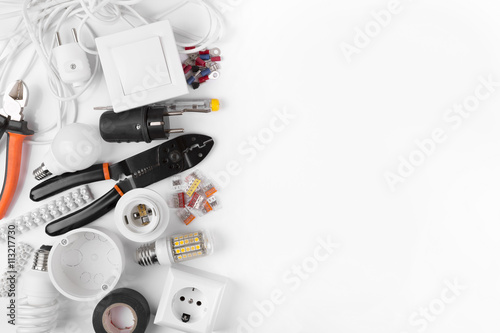 top view of electrical tools and equipment on white