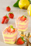 Passion fruit and strawberry mousse with fruits and spoons