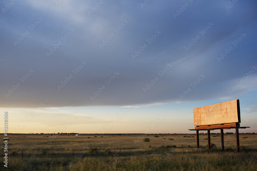 View of abandoned billboard in field View of abandoned billboard in field