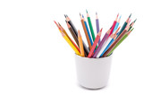 Colored pencils in cup on white background