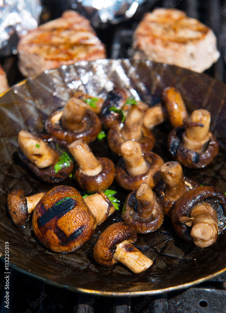 roasted mushrooms in pan on barbecue roasted mushrooms in pan on barbecue
