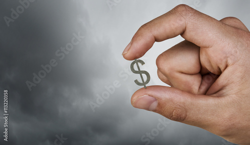 Money symbol between fingers photo