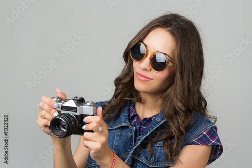 attractive young girl with a camera
