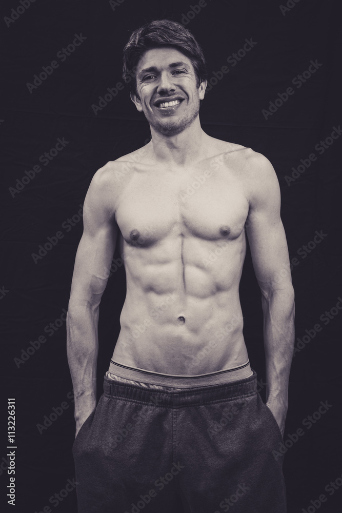 Fototapeta premium Portrait of a Muscular man in a studio