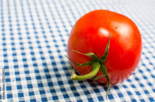 Big tomato on a crecked towel photo