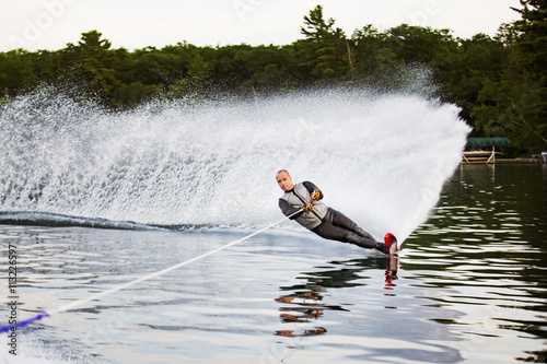 Man waterskiing on lake