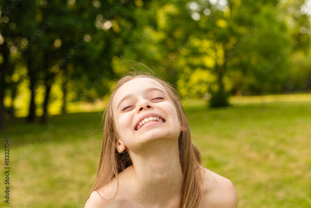 Outdoors portrait of beautiful young girl looking at you. Outdoors portrait of beautiful young girl looking at you.