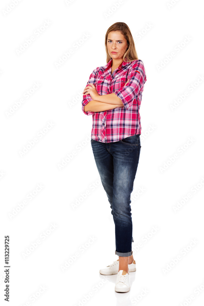 Resentful young woman with folded hands Resentful young woman with folded hands