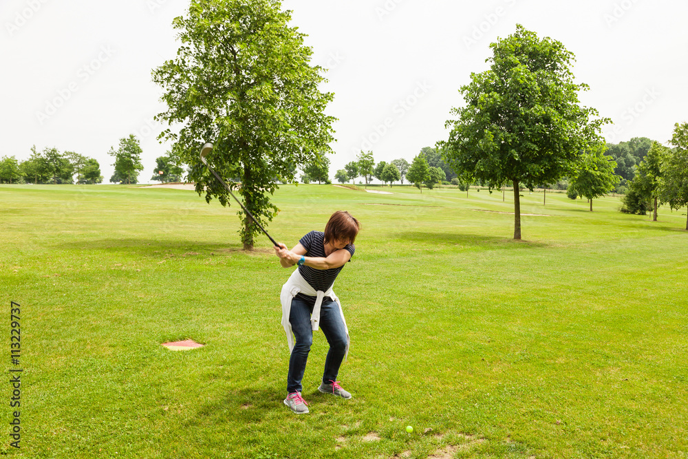Woman during the knocking on the golf course Woman during the knocking on the golf course