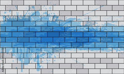 white brick wall with a paint spray