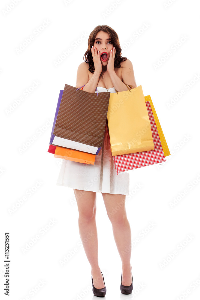 Surprised woman with shopping bags