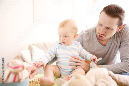 Young father having fun wit...