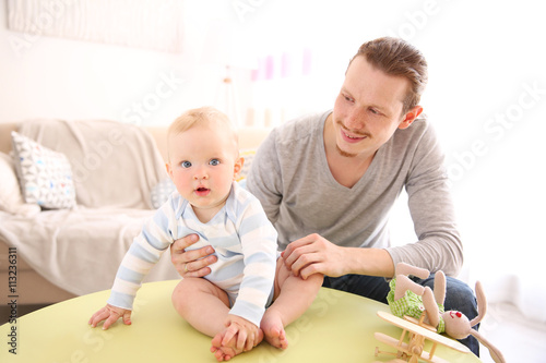 Young father having fun wit...