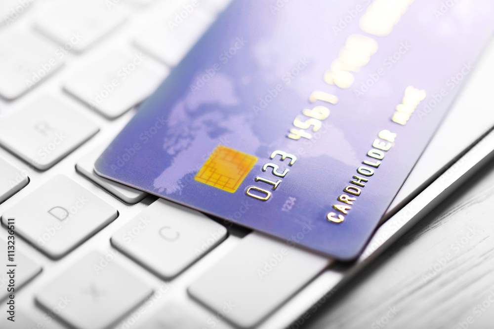 Credit card on computer keyboard closeup Credit card on computer keyboard closeup