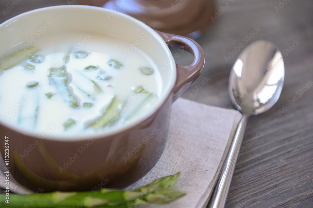 Asparagus soup on wooden table Asparagus soup on wooden table