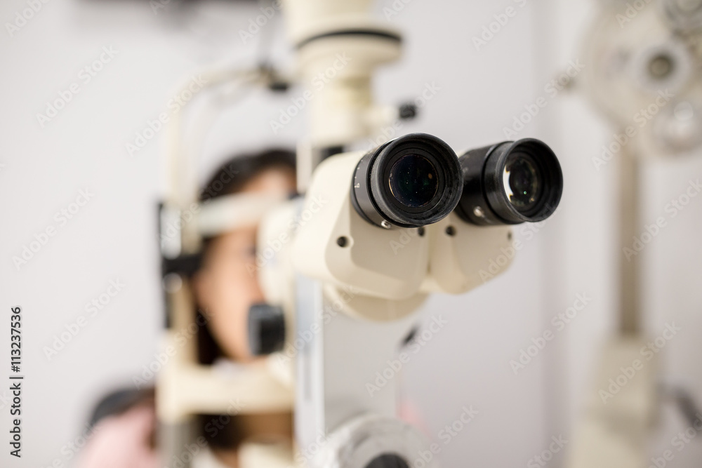 Examining a patient in ophthalmology laboratory
