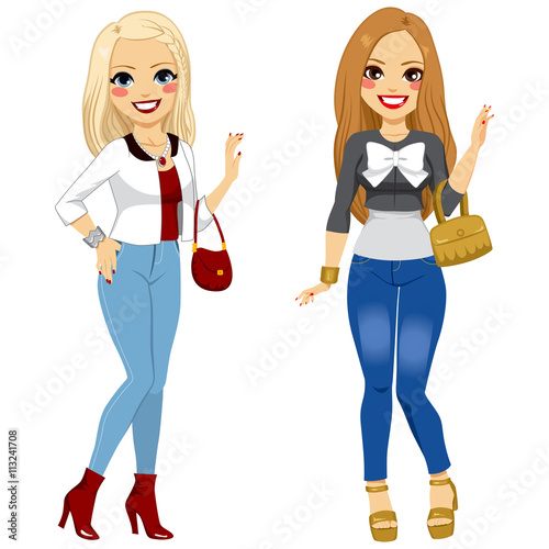 Two young beautiful fashionable girl friends posing on trendy clothes
