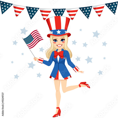 Beautiful blonde woman with Uncle Sam disguise holding flag on hand celebrating 4th of July independence day