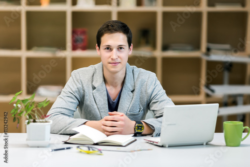Wallpaper Mural Portrait of Young corporate Trainee at cozy working Place Torontodigital.ca