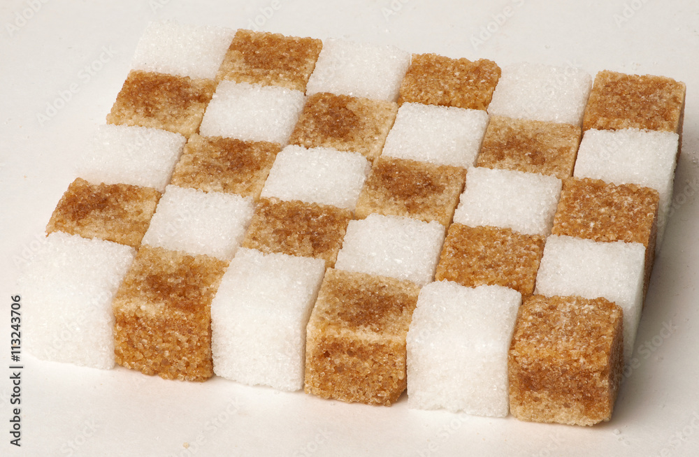 Cubes of sugar cane brown and white refined isolated Cubes of sugar cane brown and white refined isolated