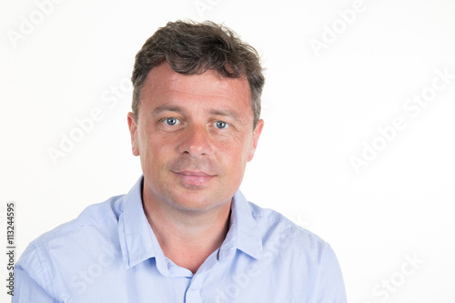 Cheerful and smiling man wearing blue shirt isolated