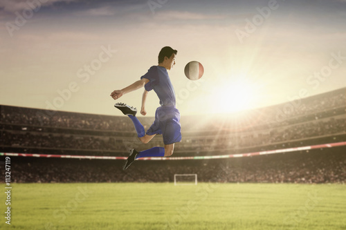 Soccer player withstand a ball