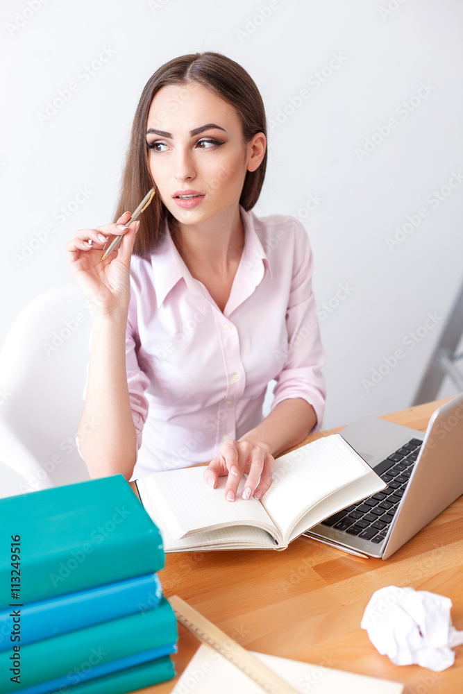 Young female student studying at home Young female student studying at home