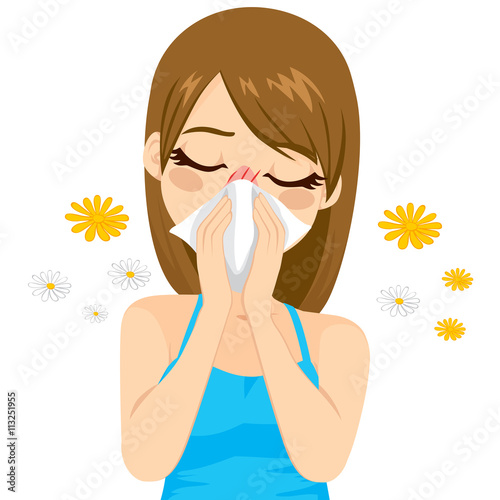 Young sick woman ill suffering spring allergy using tissue on nose