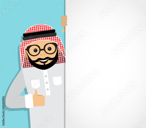 arab businessman looks out from behind a white background and shows an unfilled hand