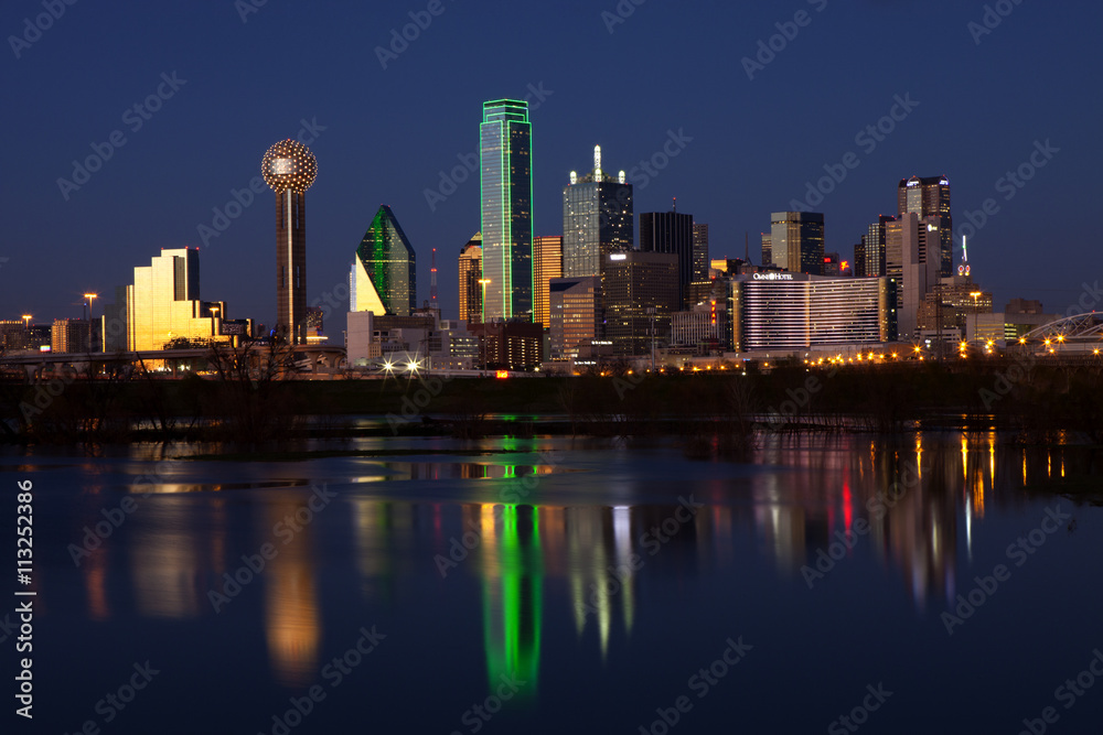 Downtowwn Dallas, Texas at night with the Trinity River in the forground