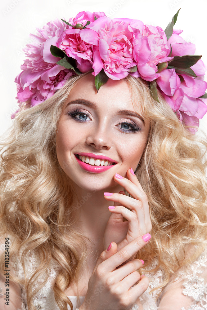Beauty woman on a white background . Bright wavy hair and a wreath of pink peonies Beauty woman on a white background . Bright wavy hair and a wreath of pink peonies