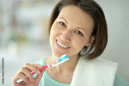 Woman  brushing her teeth