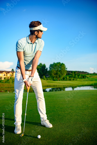 Golfer on putting green
