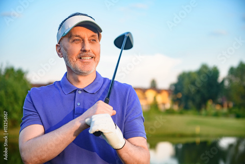 Golf player holding driver