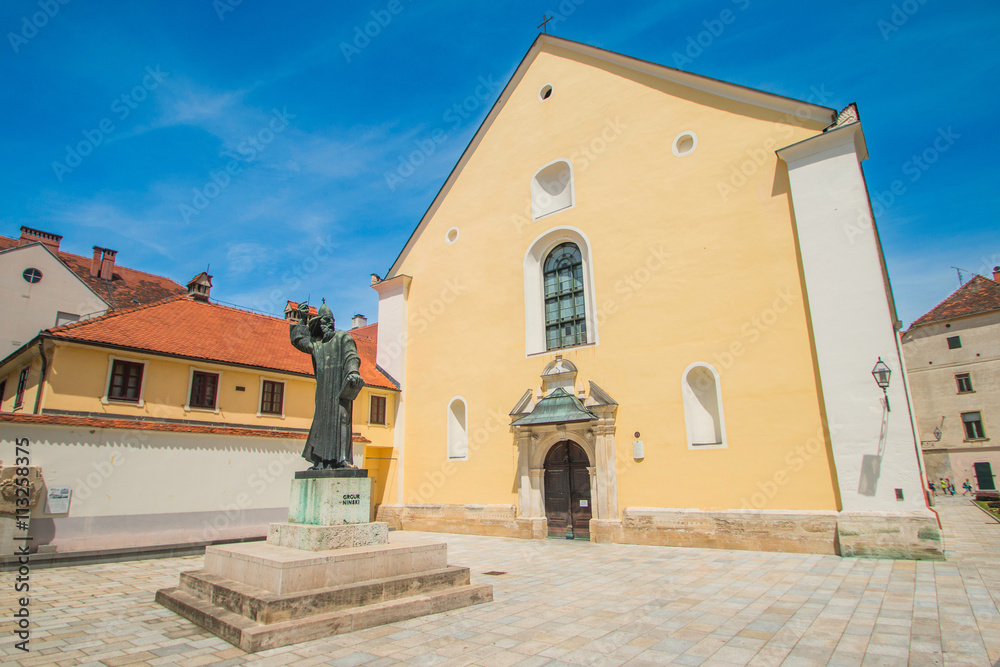 Monument of medieval Croatian bishop Grgur Ninski in Varazdin, Croatia. Sculpture made in 1931 by sculptor Ivan Mestrovic Monument of medieval Croatian bishop Grgur Ninski in Varazdin, Croatia. Sculpture made in 1931 by sculptor Ivan Mestrovic