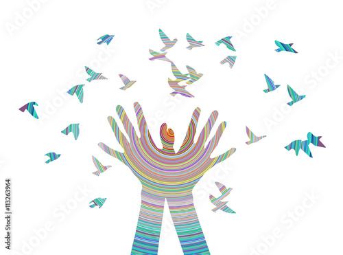 Hands releasing a flock of birds. Spring.