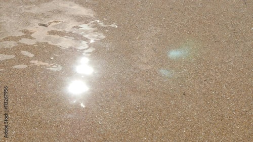 Transparent clear shallow water sparkling sea beach and sand 4K 2160p 30fps UltraHD video - Summer vacation fine ocean beach golden sand 4K 3840X2160 UHD footage