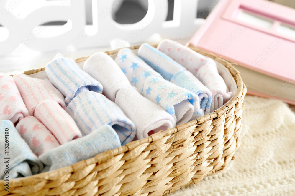 Clean baby linen on knitted plaid Clean baby linen on knitted plaid